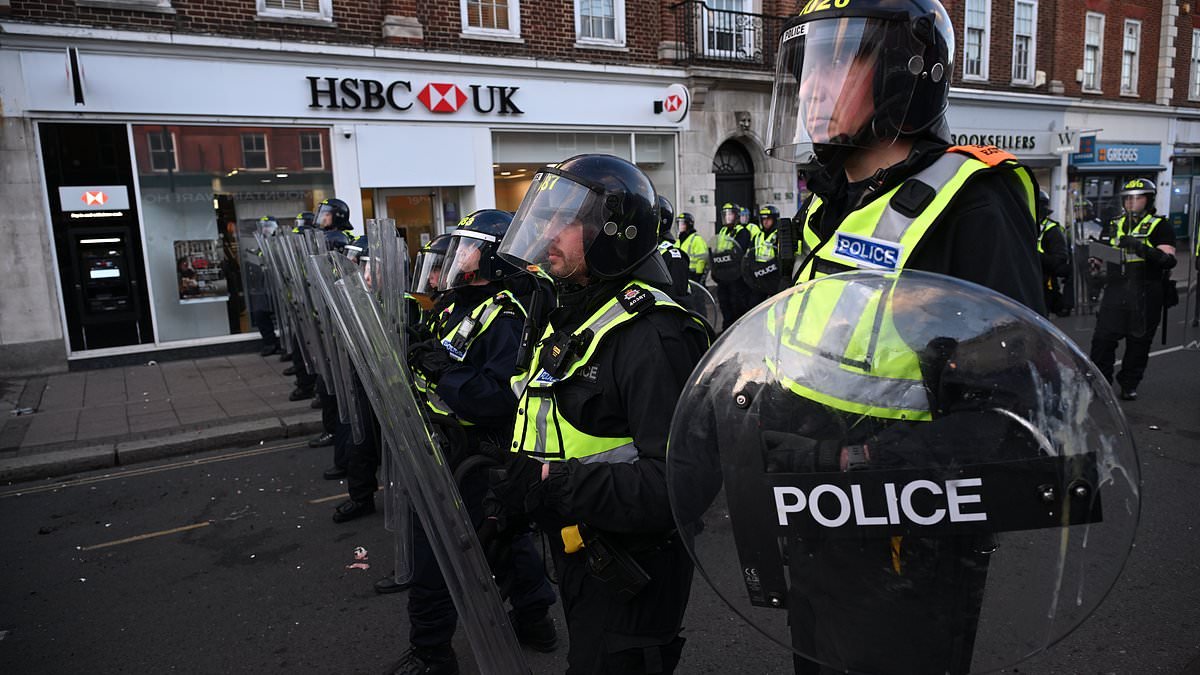 Hundreds of protesters in Epsom demand description of men 'who gang raped woman outside church' as they come face-to-face with riot police in the street