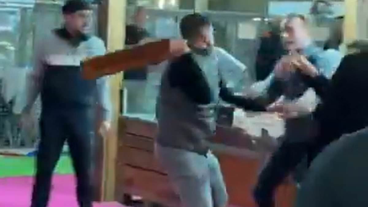 Fromage affray! Moment French farmers use cheeseboards as weapons during brawl with visitors at agriculture show