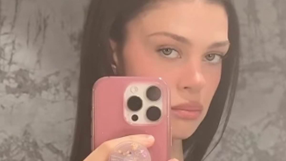 Nicola Peltz flashes a glimpse of her trim midriff in latest social media post after husband Brooklyn Beckham's ex Hana Cross said she was 'shocked' by his family row and reflected on the 'warning signs' in their relationship