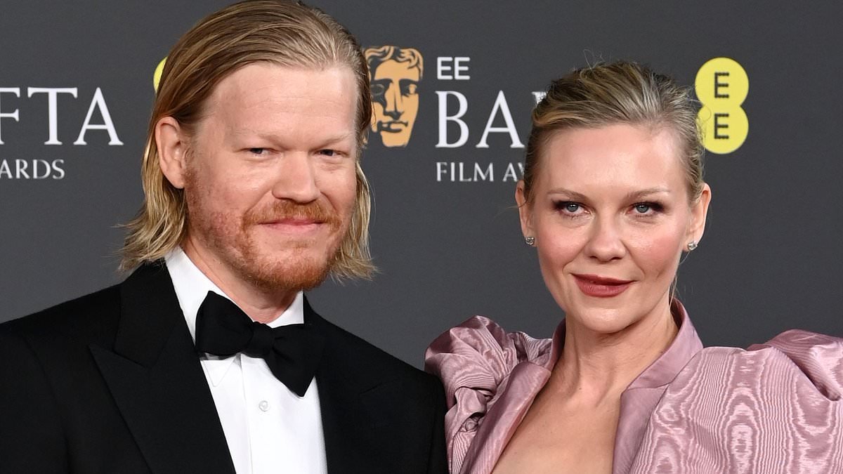 Kirsten Dunst can't keep her hands off her BAFTA nominated husband Jesse Plemons as they hit the red carpet after hitting out at his Oscars snub