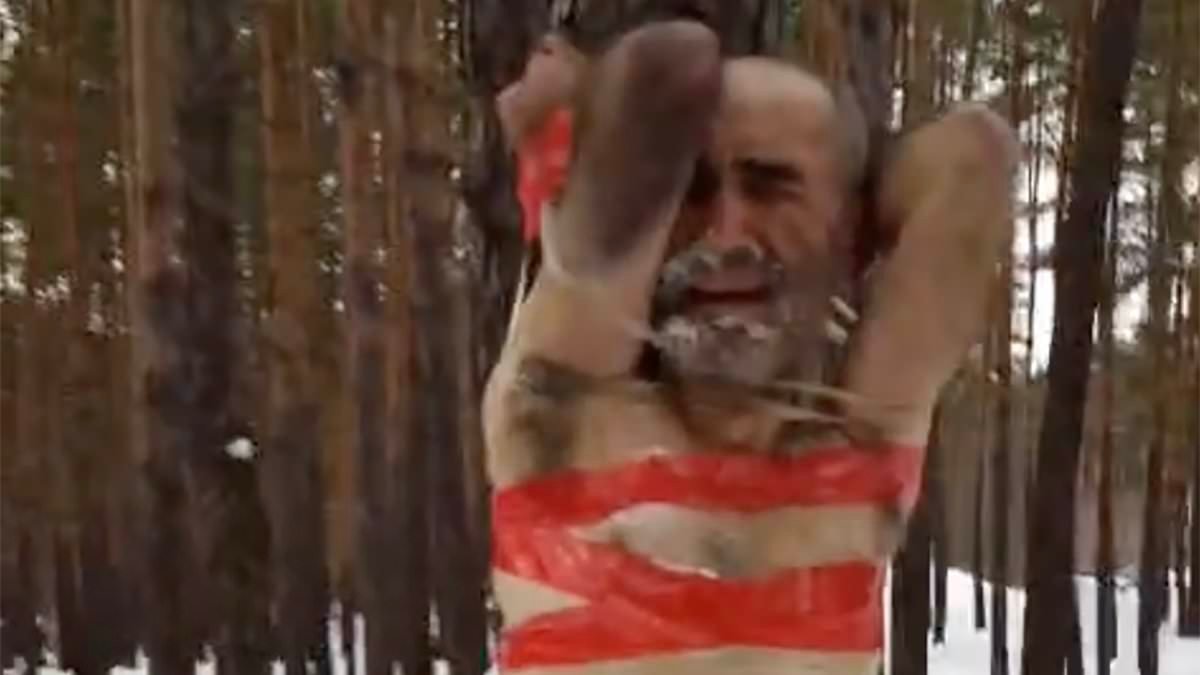 Russian soldiers are stripped to their underwear and taped upside-down to a tree in freezing conditions as punishment for refusing to join meat-grinder assaults