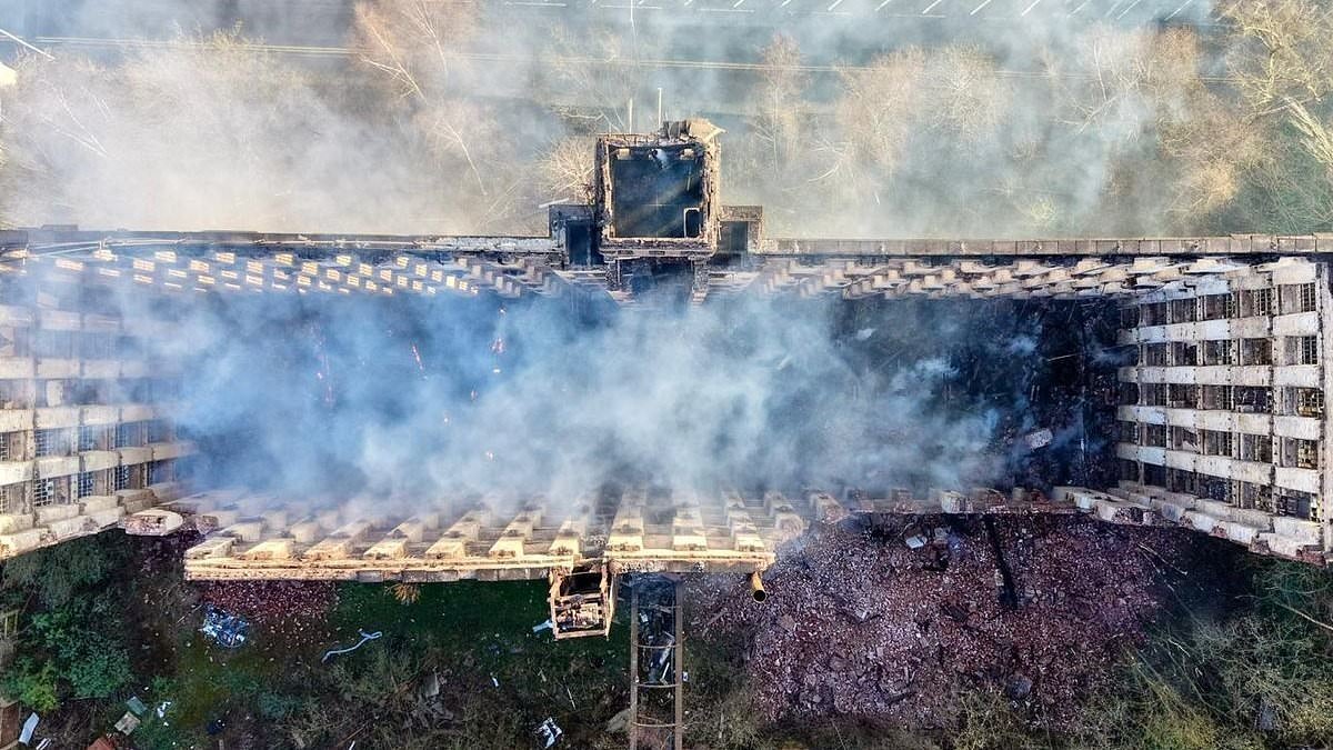 Teenager is arrested for arson after fire rips through historic Grade II-listed building as aerial pictures show roof and six floors destroyed