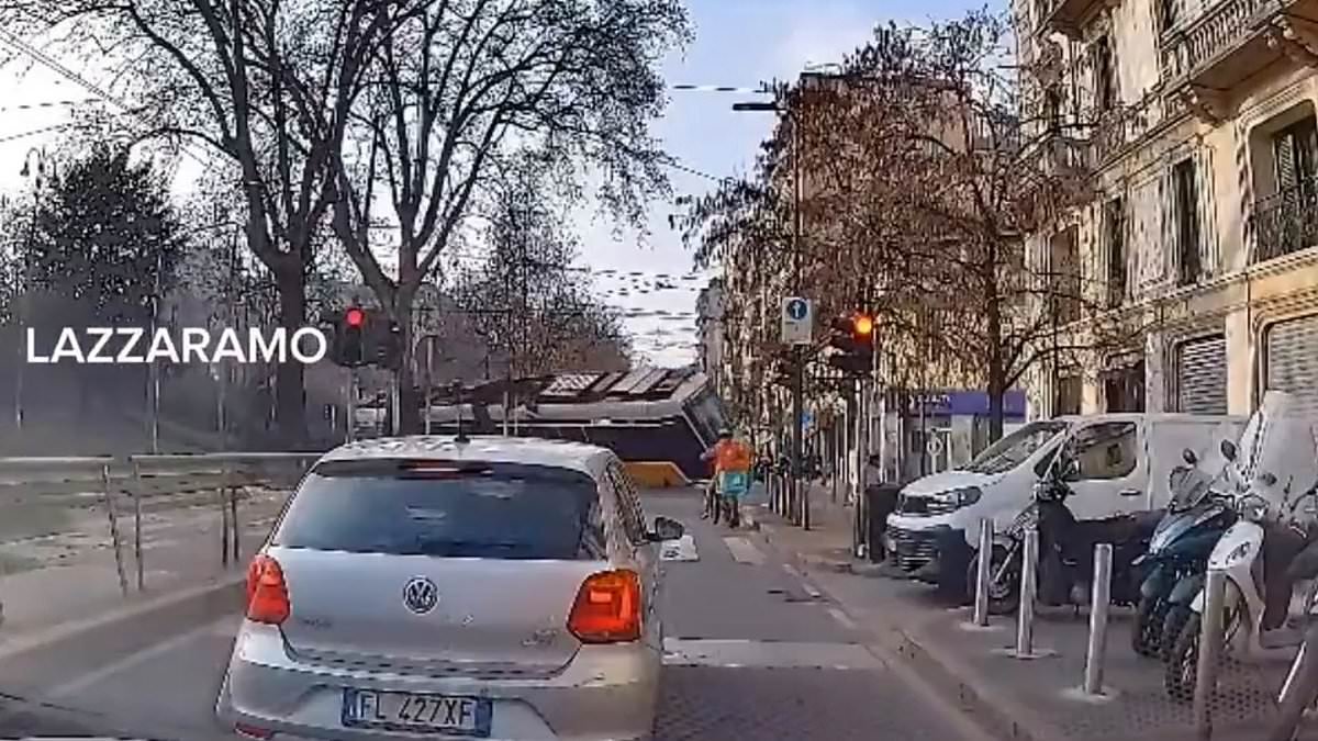 Moment tram derails and crashes into building in Milan - leaving at least two dead and 40 injured