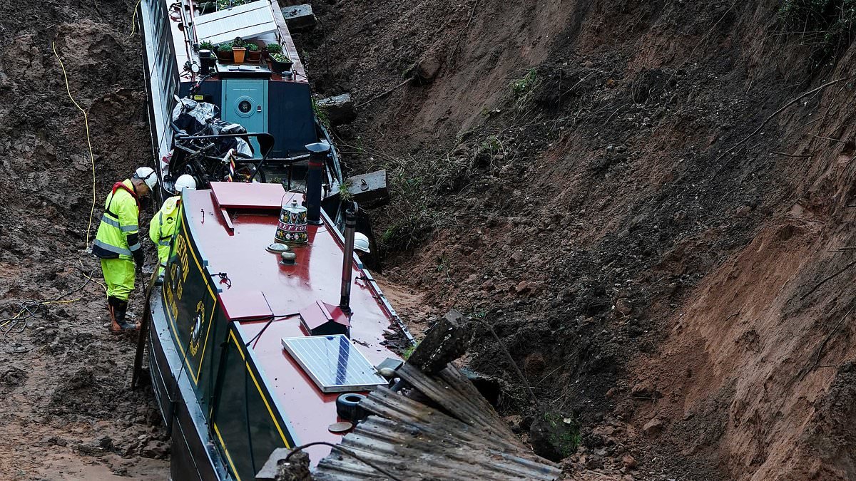 Deserted narrowboats are still stuck in the mud of drained canal weeks after dramatic embankment collapse