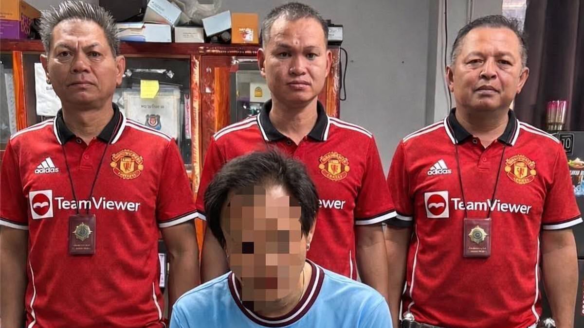 Thai police mock Man City fan 'found with drugs' just hours after his team's loss to United... by donning their red jerseys