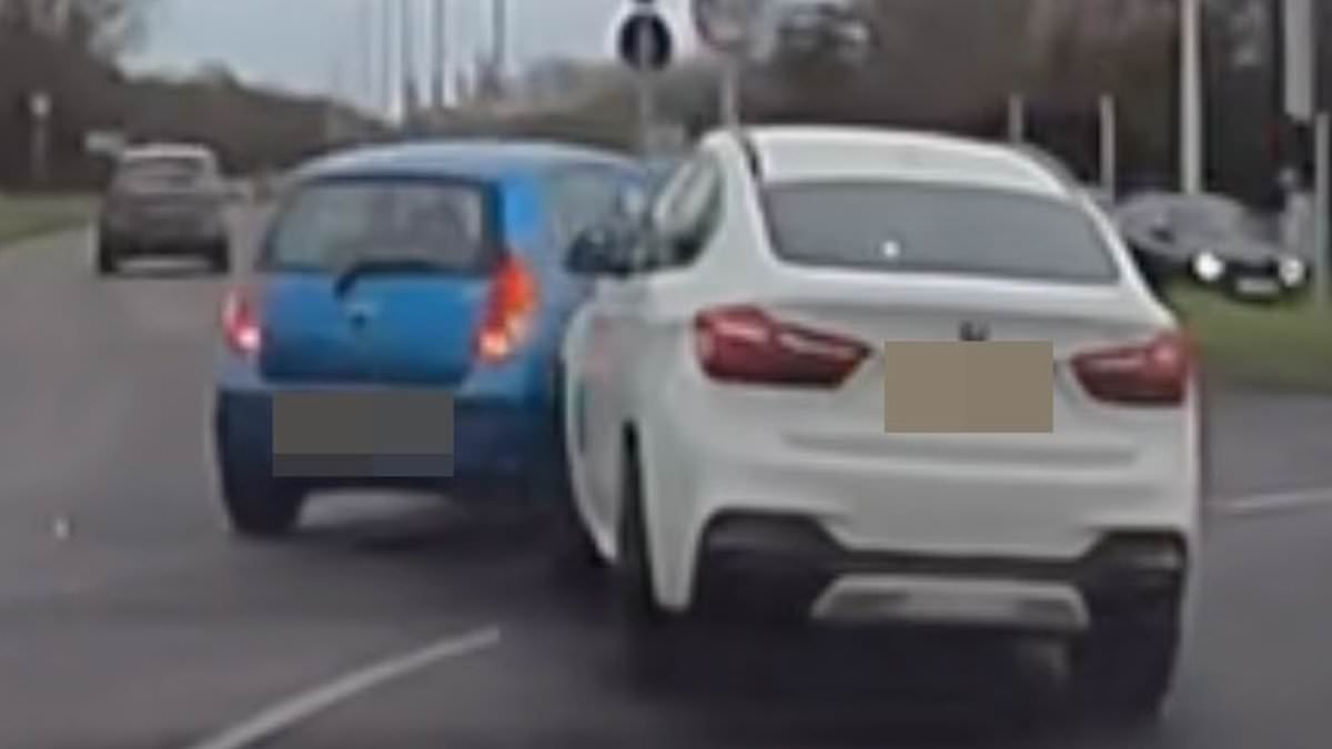 Moment BMW smashes into Hyundai as drivers get their roundabout lanes mixed up - but who is in the wrong?