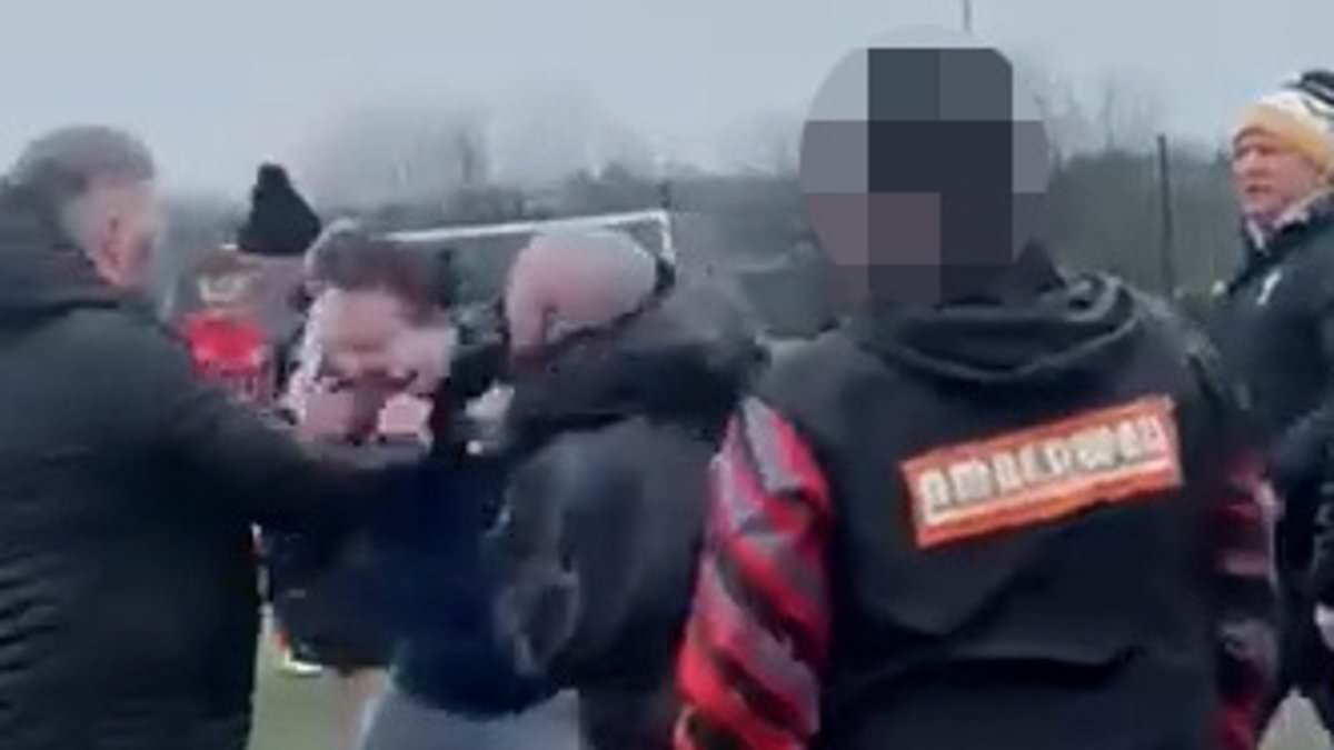 Moment brawl breaks out between parents at under 14s football match as children are forced to pull adults apart