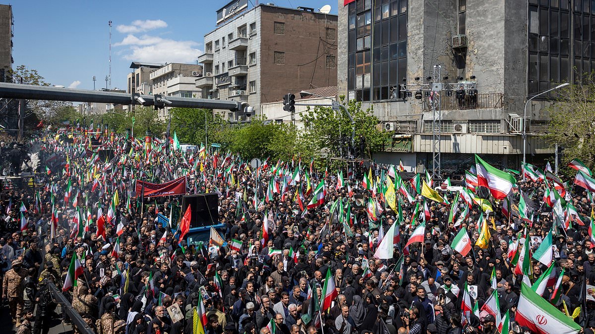 Iran holds huge victory parade with thousands spilling onto the streets of Tehran as ceasefire falls apart
