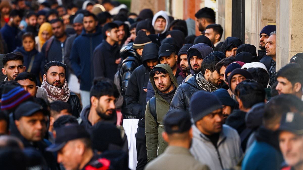 Socialist Spain approves plan to grant 500,000 migrants legal status - with migration officials warning it will cause system to collapse