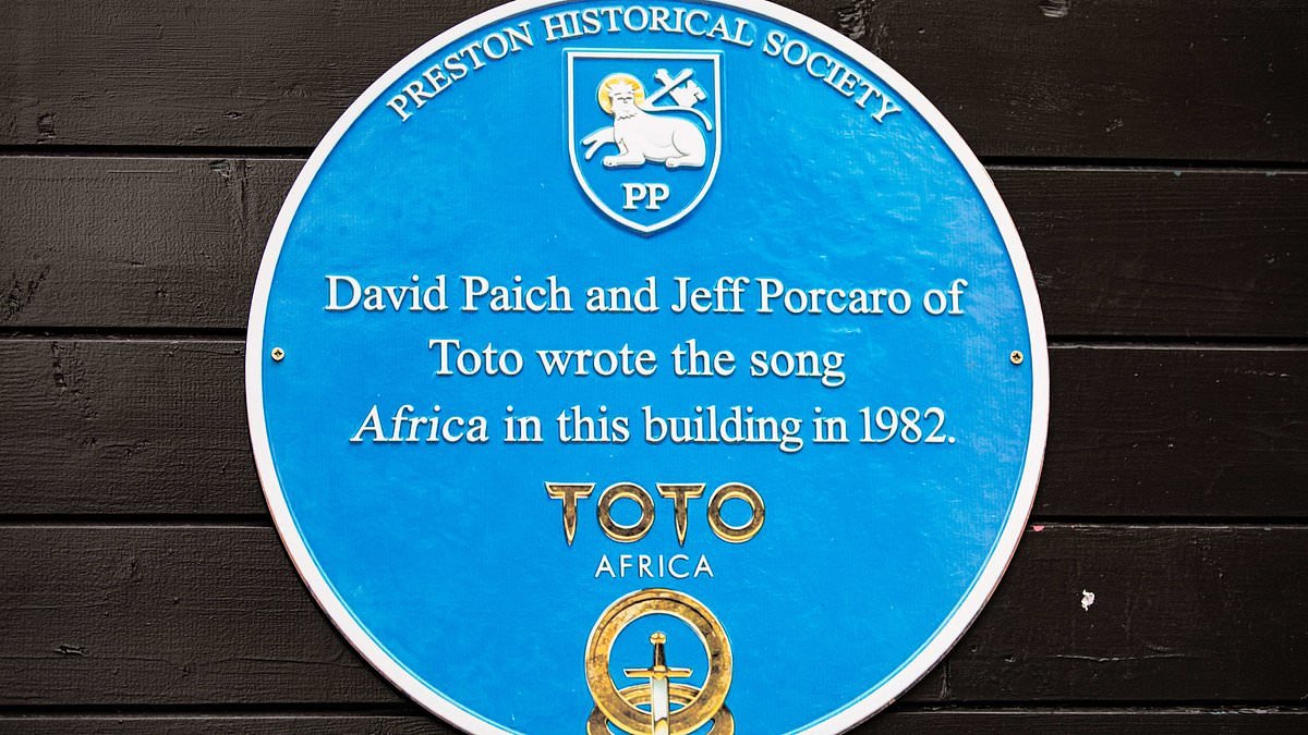 Burger bar clashes with town's historical society after erecting spoof blue plaque claiming Toto wrote 'Africa' on its premises
