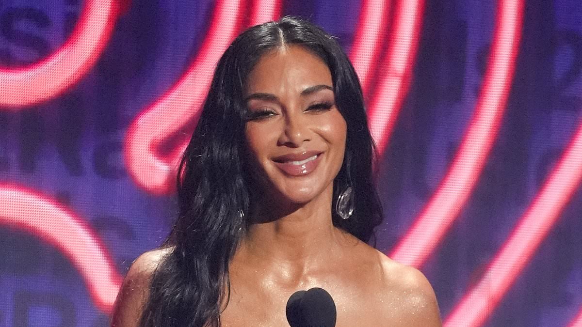 Nicole Scherzinger gives Pussycat Doll tour a shameless plug on stage as she stuns in leather strapless dress at iHeartRadio music awards
