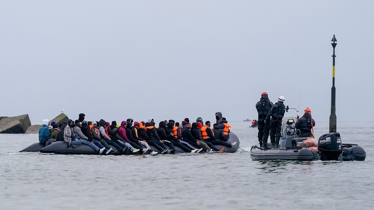 French police watch on as migrants wade into the sea to board UK-bound boats - days after four died in attempted crossing