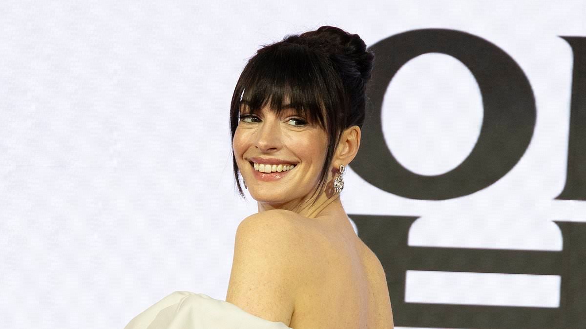Anne Hathaway, 43, sports chic new bangs amid speculation about her remarkably youthful looks as she reunites with Meryl Streep for The Devil Wears Prada 2 event in Seoul