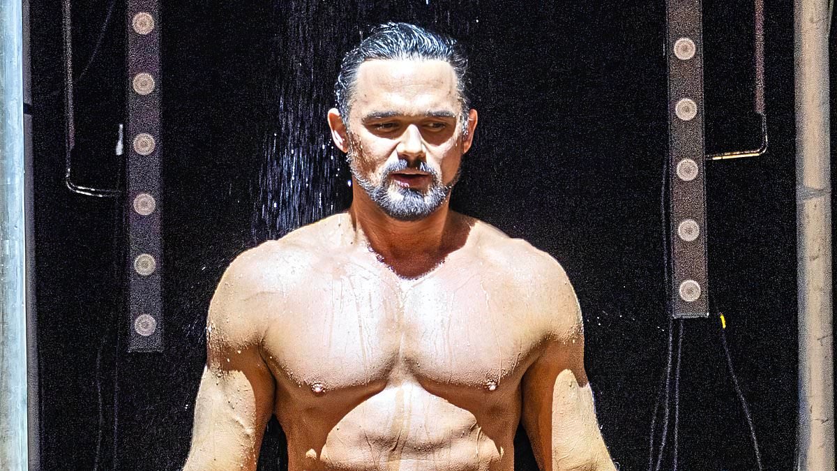 Gareth Gates, 41, sends fans wild with his rippling physique after stripping down to a pair of tight swimming trunks for new musical roadshow Boyband In The Buff