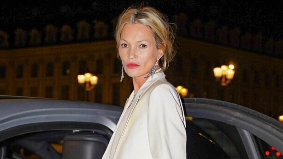 Kate Moss oozes class in a chic cream trouser suit as she exits her Paris hotel after attending the Tom Ford show during Paris Fashion Week