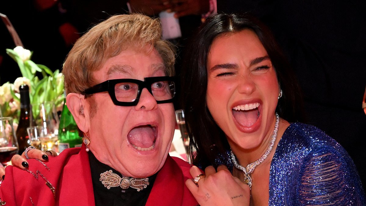 Elton John reunites with longtime pal Dua Lipa in VERY spirited snaps as she splashes the cash during the charity auction at his Oscars viewing party