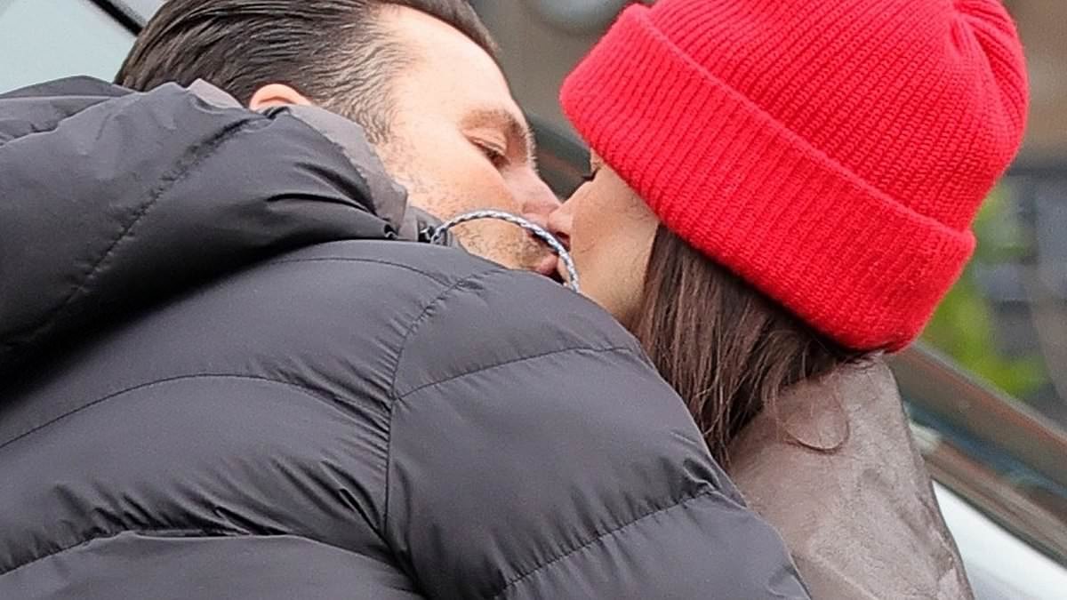 Michelle Keegan and her husband Mark Wright put on a rare public display of affection as they kiss passionately at a Cheshire train station