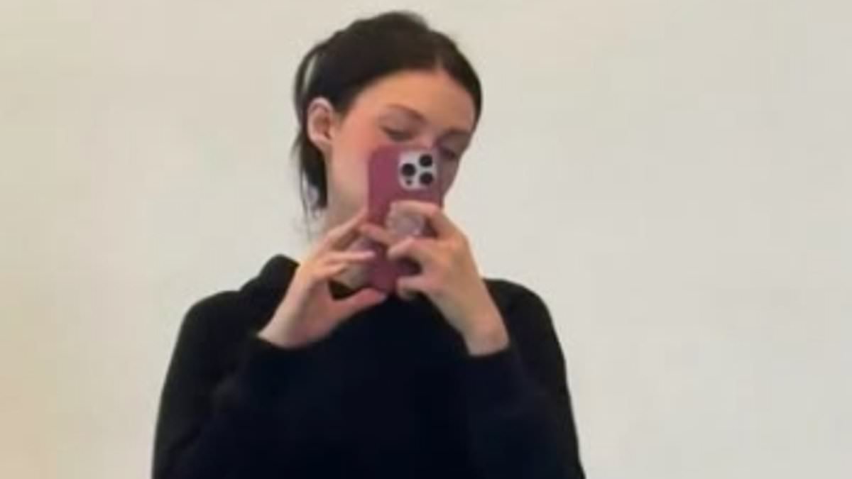 Nicola Peltz poses in black gym shorts as she does the splits in latest post - after sparking concern with drastic weight loss from ballerina training