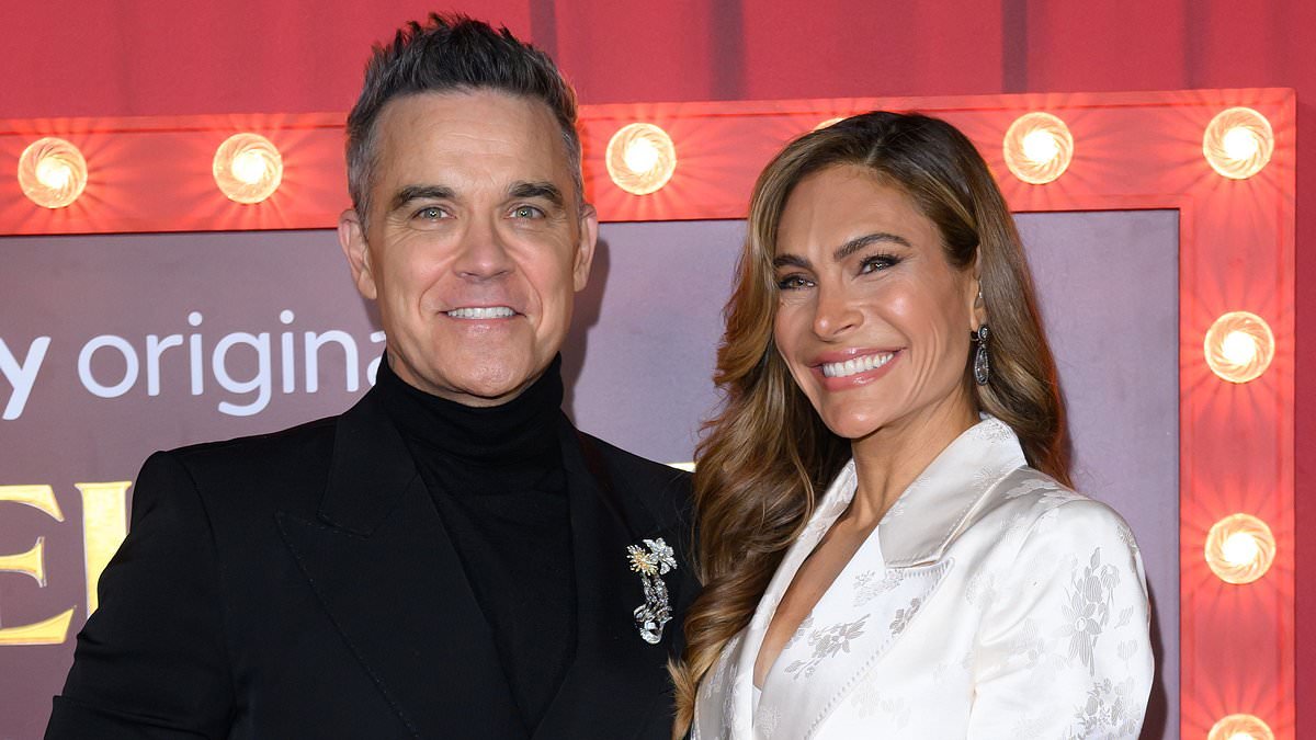 Robbie Williams says he has been an 'absent parent' after five months on tour as he pays tribute to wife Ayda for 'making him a man'