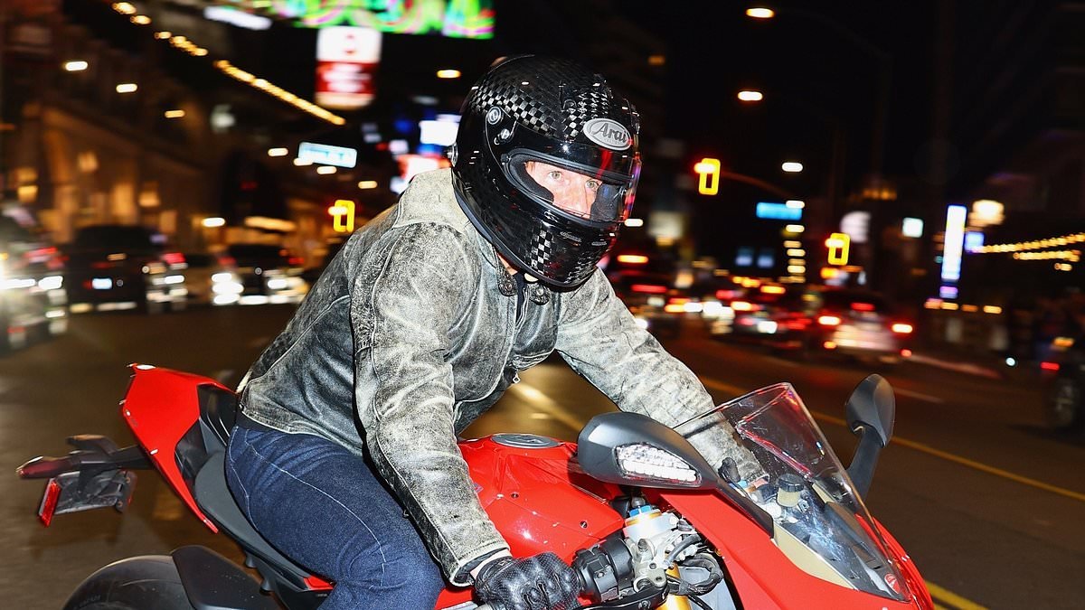 Tom Cruise arrives at Sunset Tower Hotel on his £31,000 superbike as he is seen for the first time since 'abruptly' ditching his £35million London flat and returning to the United States