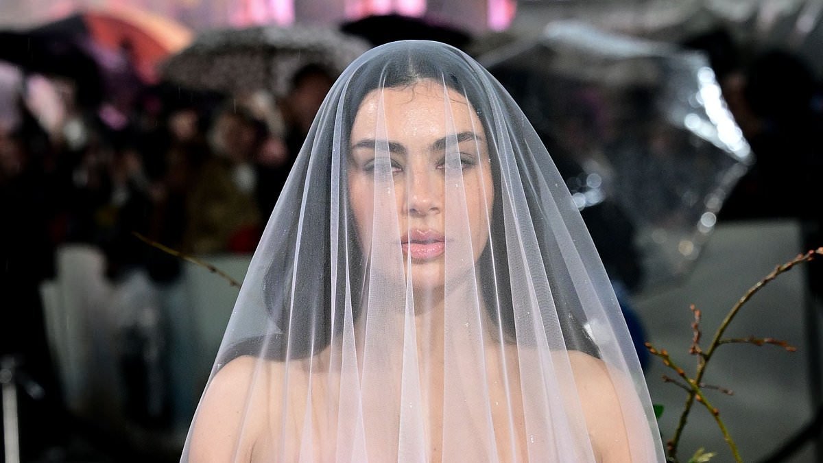 Charli XCX turns heads in a dramatic pink bridal style gown as she attends Wuthering Heights London premiere