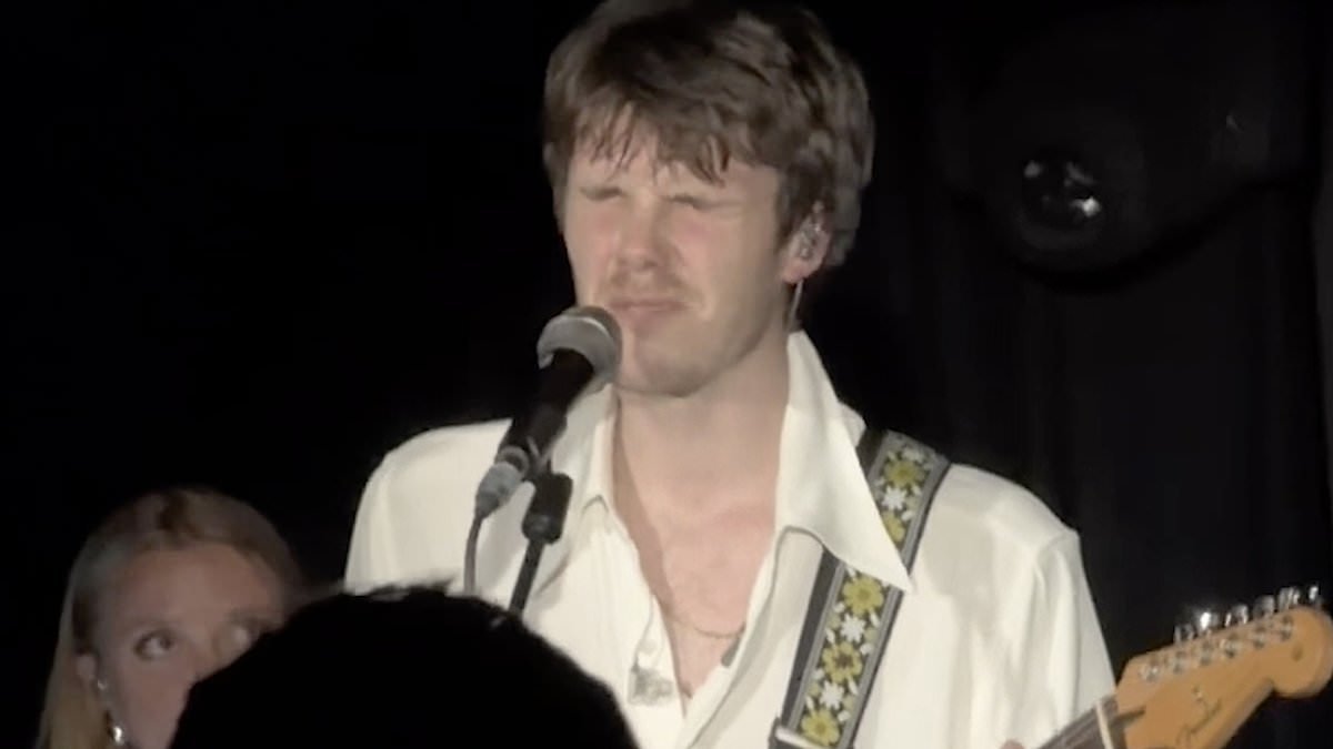 Cruz Beckham chokes back tears while performing new single 'inspired by brother Brooklyn's estrangement' in front of emotional brother Romeo and parents David and Victoria and at London show