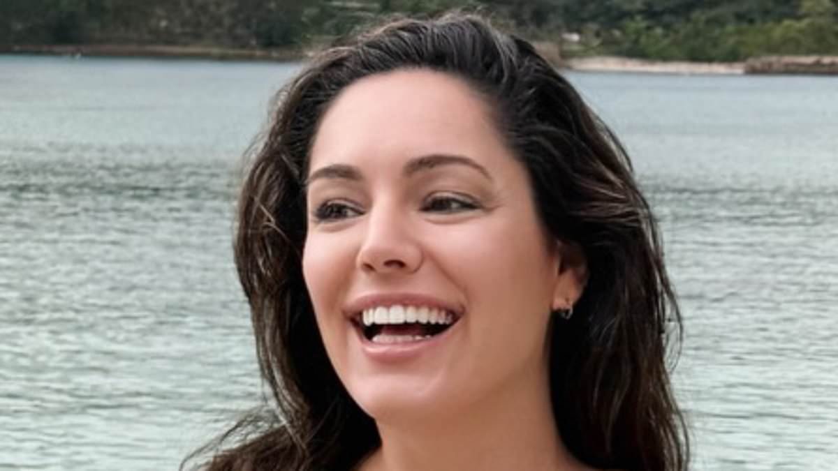 Bikini-clad Kelly Brook showcases her curves as she reveals she has 'a clean bill of health' following a £2,395 early detection MRI scan