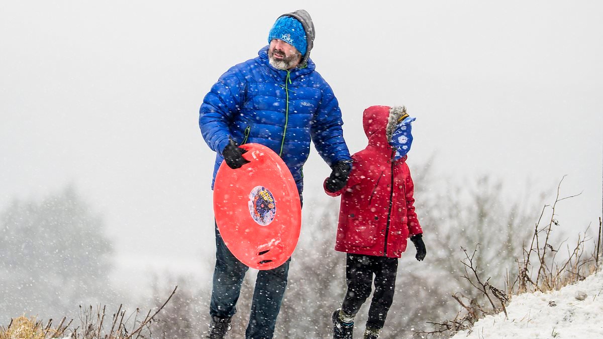 Families make the most of the snow as they grab their sledges for outdoor fun despite chilly conditions