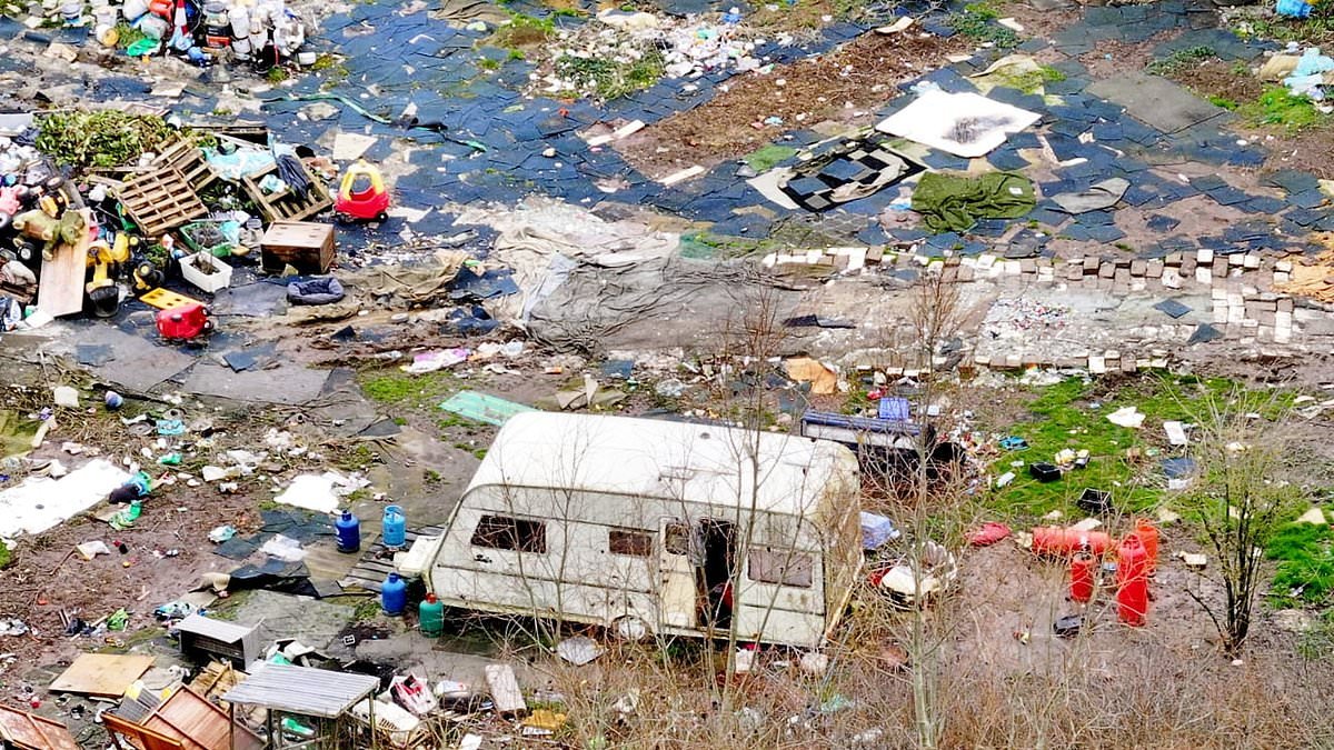 Travellers leave behind 'war zone': Litter, dirty nappies and burn-out caravan left behind after council evicted them from illegal site