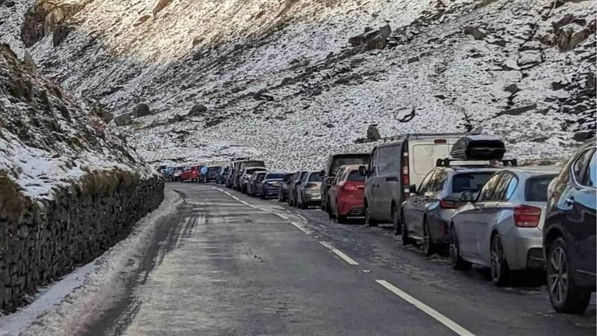 Police blast Instagram tourists for their 'dangerous parking' on snow-covered Welsh mountain as Britain counts cost from deadly Storm Goretti - with warnings more chaos is on the way