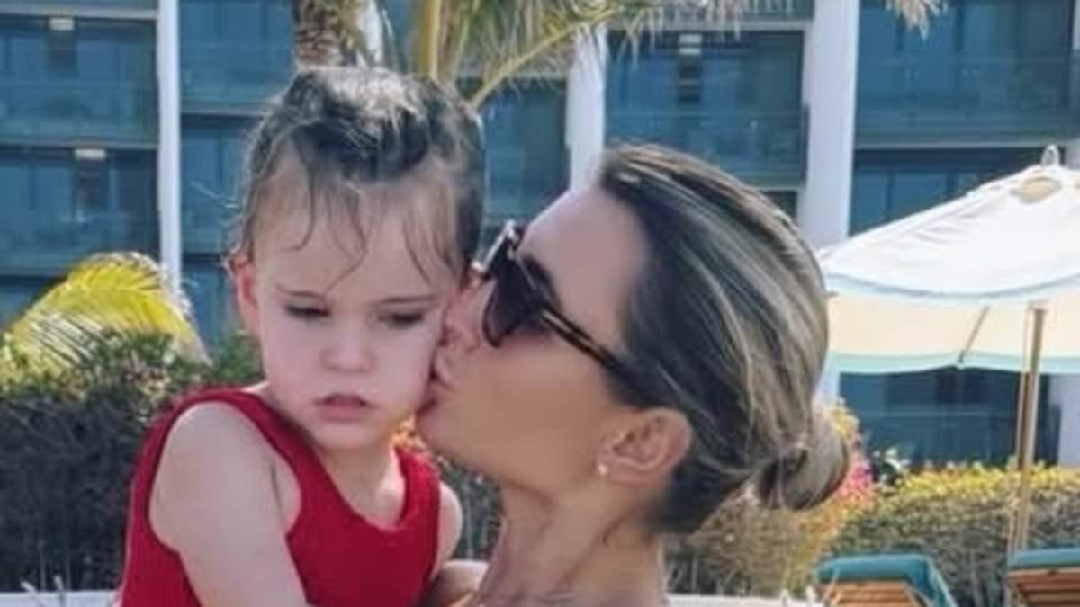 Billie Faiers slips into a red bikini as she poses for sweet family snaps on her half term holiday to Abu Dhabi