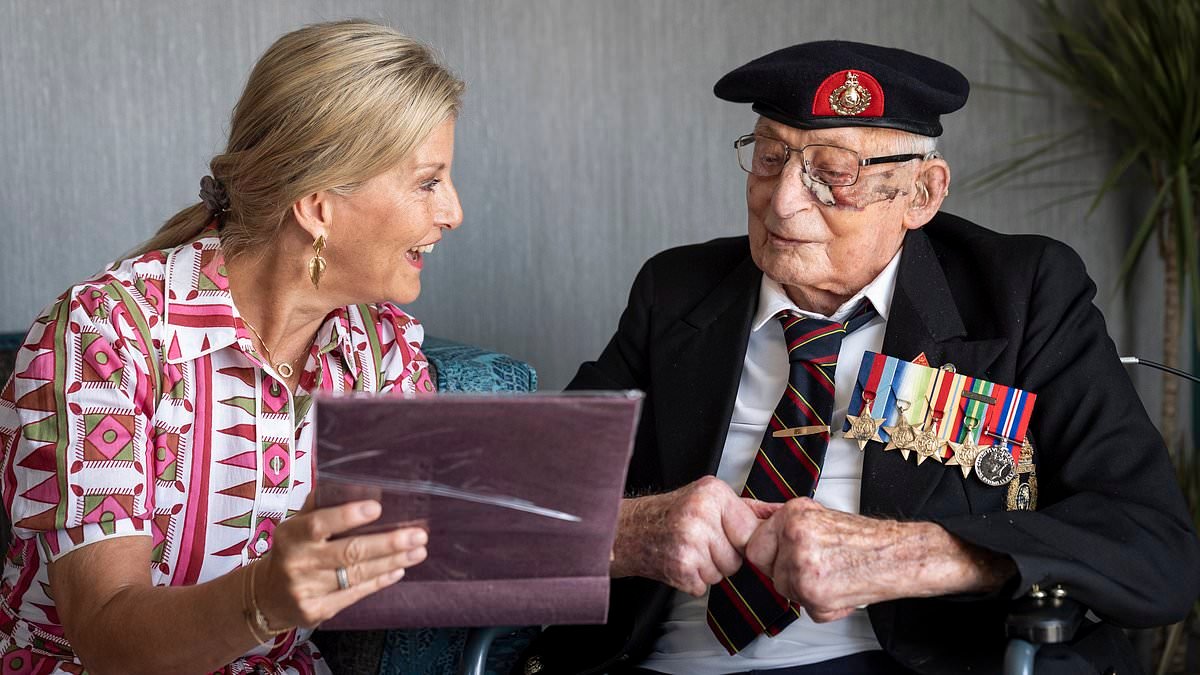 A fitting tribute to a national hero: Hundreds of mourners pay their respects to one of the last remaining Royal Marine veterans of WW2 after his death aged 105