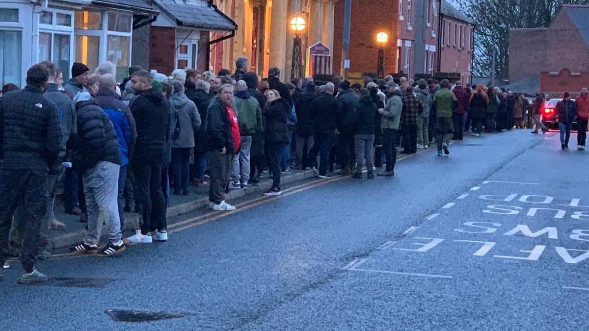 Welsh village erupts in fury over plans to house 70 asylum seekers in a former care home as 500 locals queue up to protest
