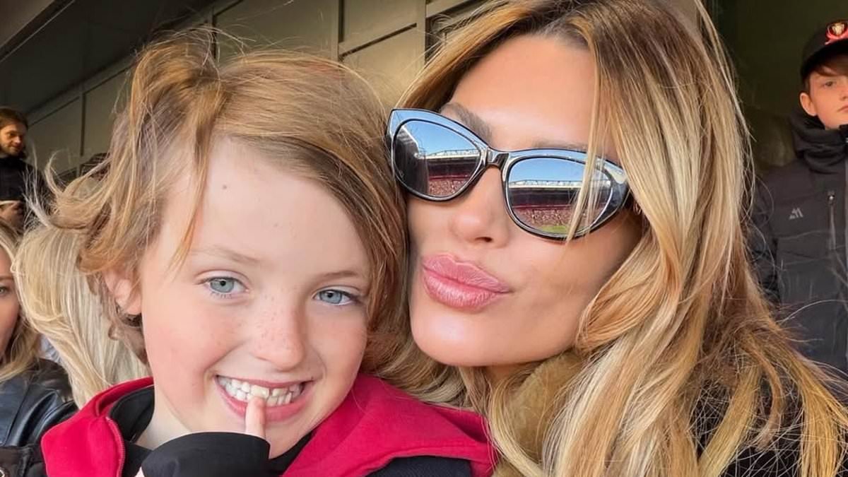Abbey Clancy takes her lookalike daughters and sons to Anfield to support her footballer husband Peter Crouch during a charity match