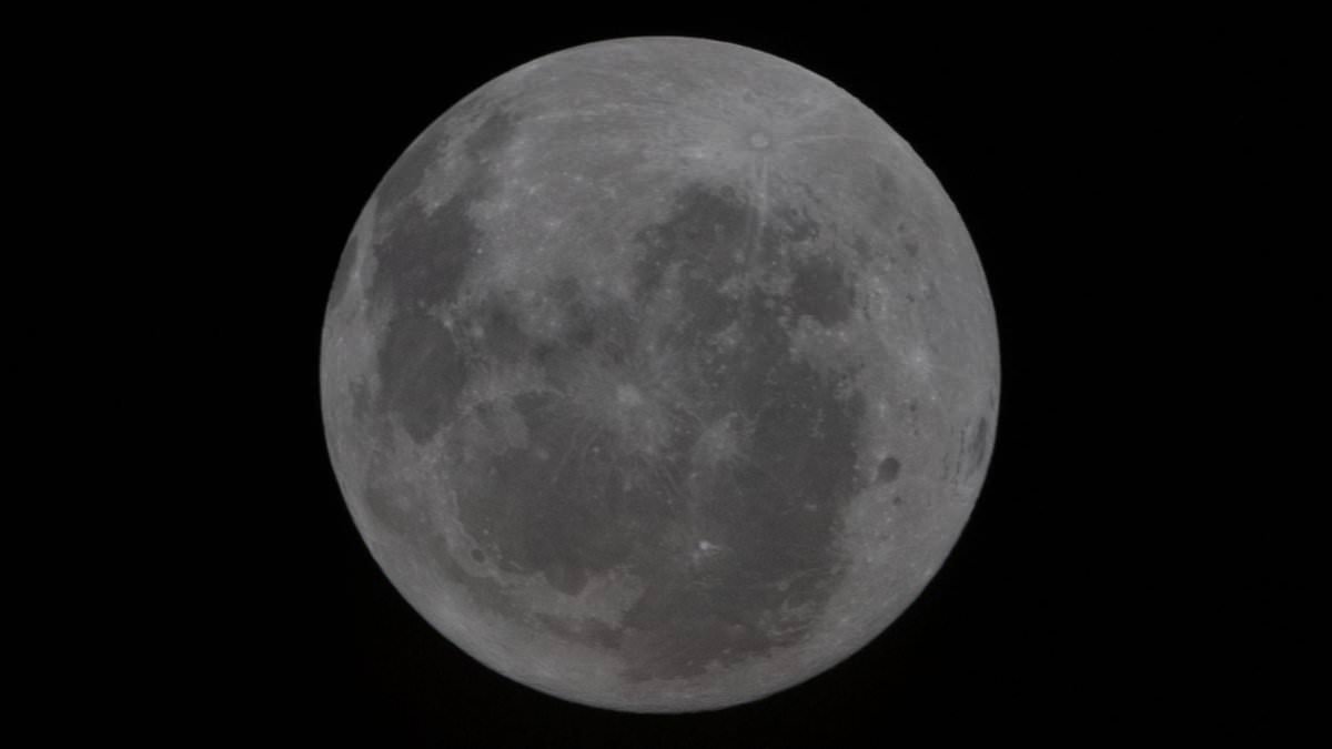 'History in the making': NASA crew releases landmark image of the moon as astronauts set for historic fly-by - after being forced to fix the loo again!