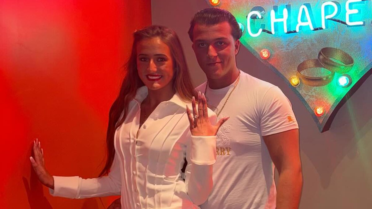 Venezuela Fury, 16, flashes her engagement ring and wears a bridal white minidress as she jokes 'not yet' while posing against 'wedding chapel' sign with fiancé Noah Price, 17