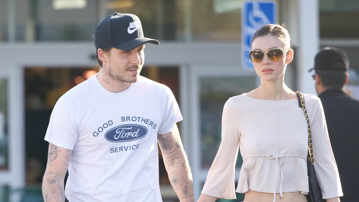 Brooklyn Beckham displays his covered up tattoo tribute to his dad David after severing ties with his family for good as he steps out with wife Nicola in LA
