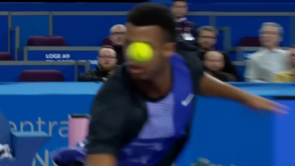 Tennis player forced to RETIRE from his match after slicing the ball into his own EYE