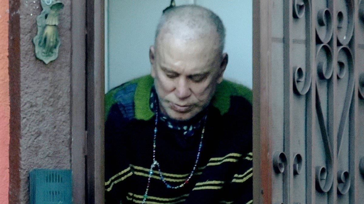 Bald Mickey Rourke, 73, emerges for Taco Bell at LA home he faces eviction from over $60,000 unpaid rent