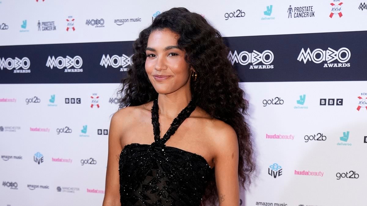 Olivia Dean joins Leigh-Anne Pinnock, Indiyah Pollack and topless Tallia Storm at the MOBO Awards as emotional singer is named Best Female Act and dedicates win to her mum