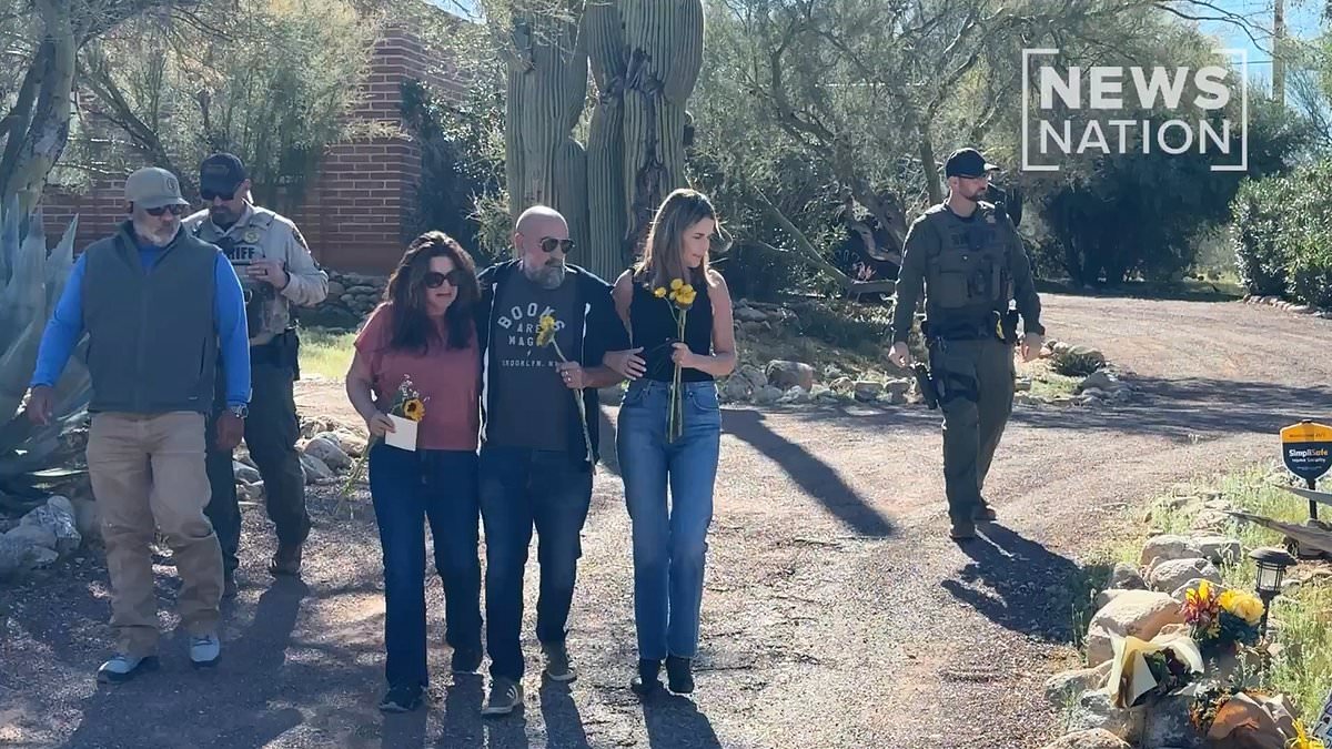 Savannah Guthrie lays flowers outside missing mother Nancy's home and embraces sister and brother-in-law