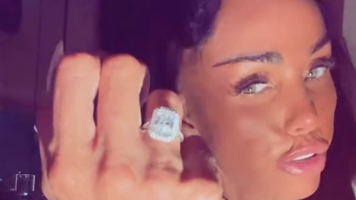 Katie Price shows off giant diamond engagement ring as she kisses her fiancé Lee Andrews after businessman proposed on Dubai holiday