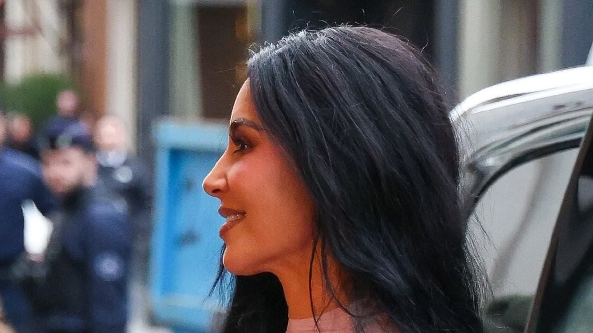 Kim Kardashian beams as she arrives in Paris with Lewis Hamilton for NikeSKIMS event after their weekend away in the Cotswolds amid their 'secret romance'