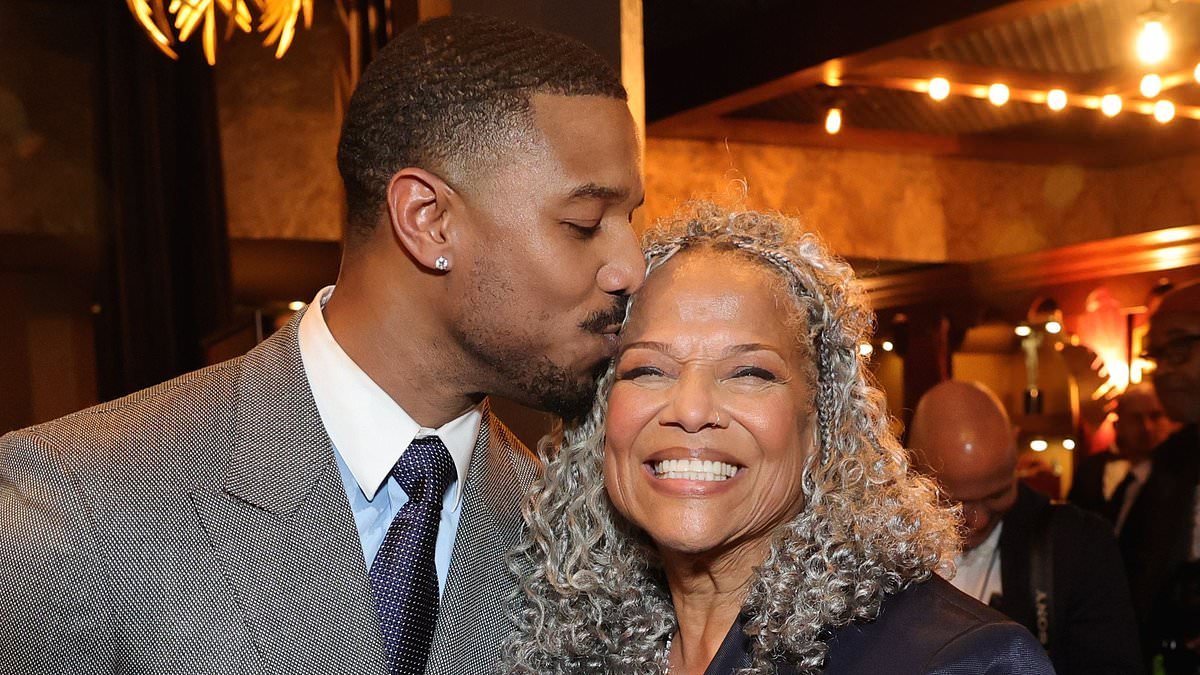 Michael B. Jordan plants a kiss on his proud mother Donna as he celebrates surprise win of top prize at the Actor Awards