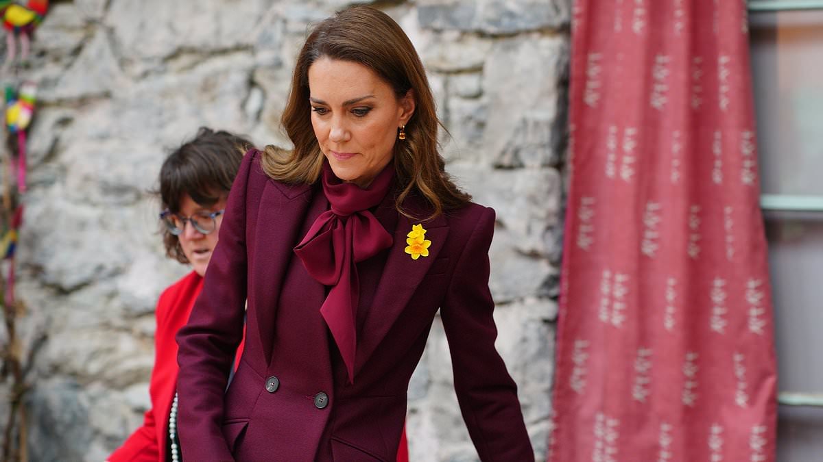 Burgundy beauty! Kate drenches herself in head to toe red as she joins Prince William in Wales ahead of St David's Day