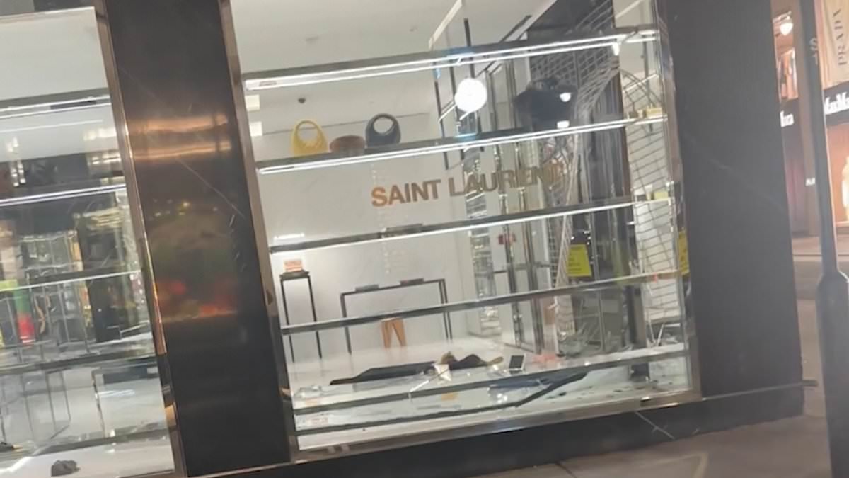 Brazen thieves smash their way into Yves St Laurent on London's Bond Street and flee with haul of luxury handbags