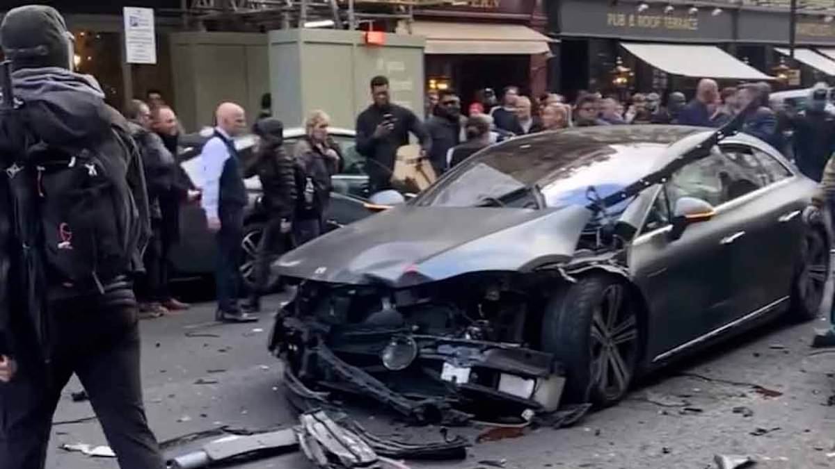 Moment man is arrested after 'crashing stolen car into pedicab as it was being chased by police' in packed Soho