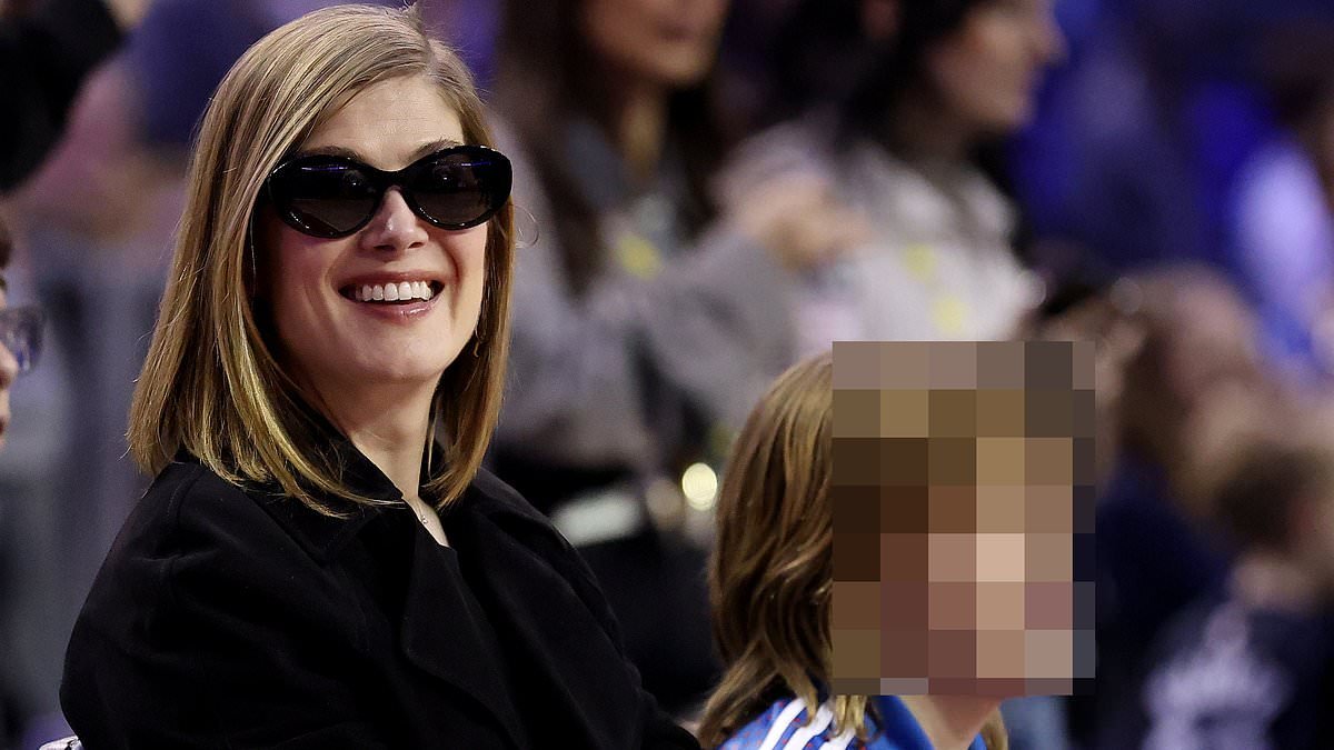 Rosamund Pike makes a rare appearance with son Atom, 11, as they attend star-studded NBA game at London's O2