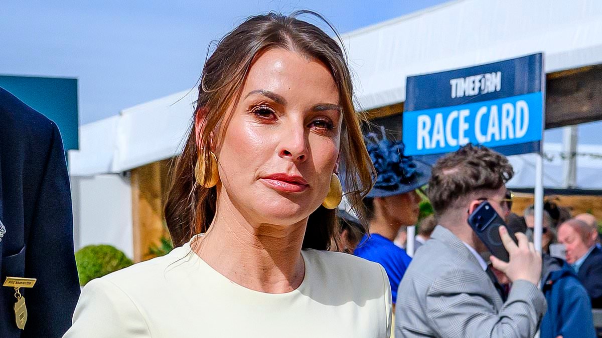 Coleen Rooney wows in figure-hugging cream dress as she cosies up to husband Wayne in the stands ahead of the Grand National at Aintree