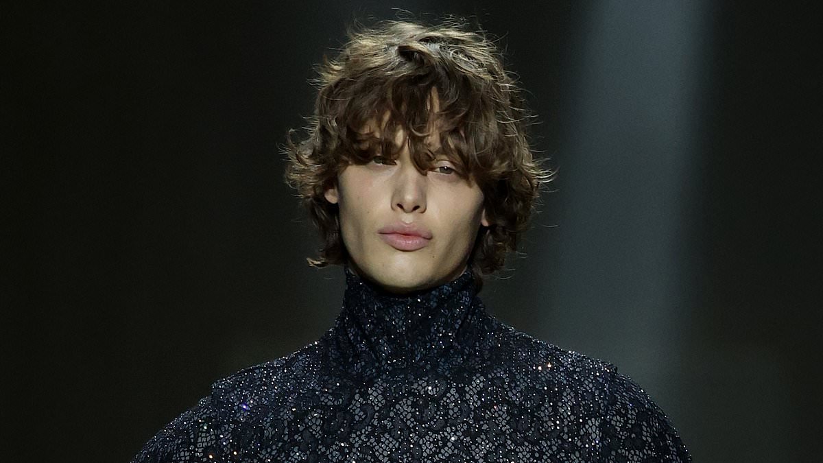 Barefoot Bobby Brazier shows off his top model pout as he walks the runway at Gucci's MFW show